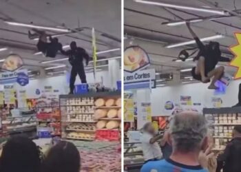 Polcia chamada no Rio aps homem se pendurar em supermercado | FOLHAMAX